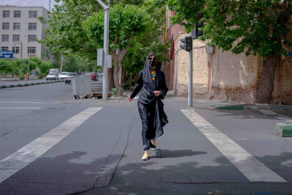 Young veiled woman in an alley off Enghelab Street, Tehran, 2022 — from the Women in Public Space project