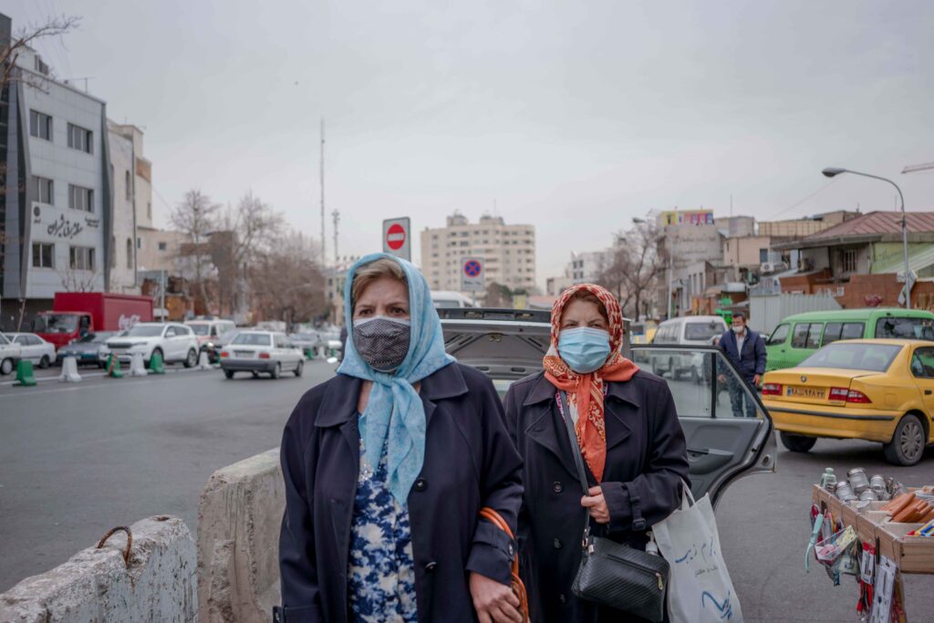 Two elderly women wearing masks, Tajrish Square, Valiasr Street, Tehran, 2020–2021 — from the Women in Public Space project