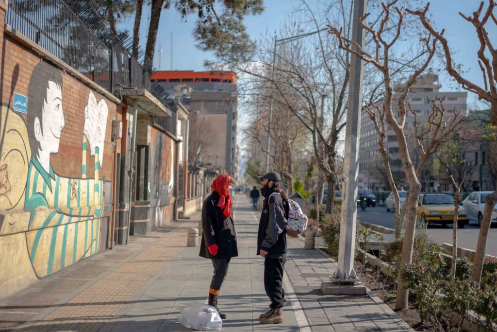 Young couple on Enghelab Street near Felestin Street, Tehran, 2020–2021 — from the Women in Public Space project